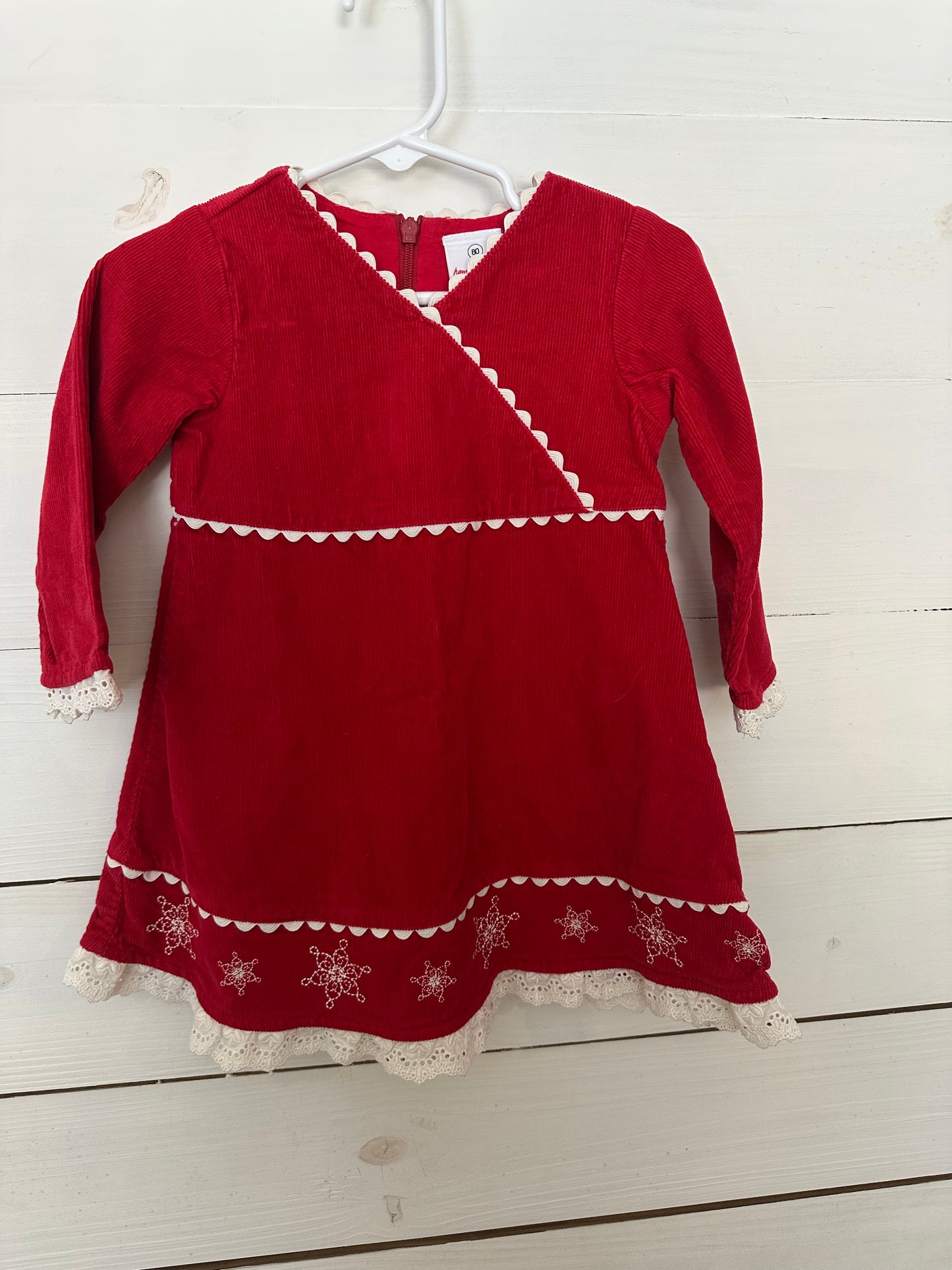 Hannah Anderson: Red corduroy dress with snowflakes