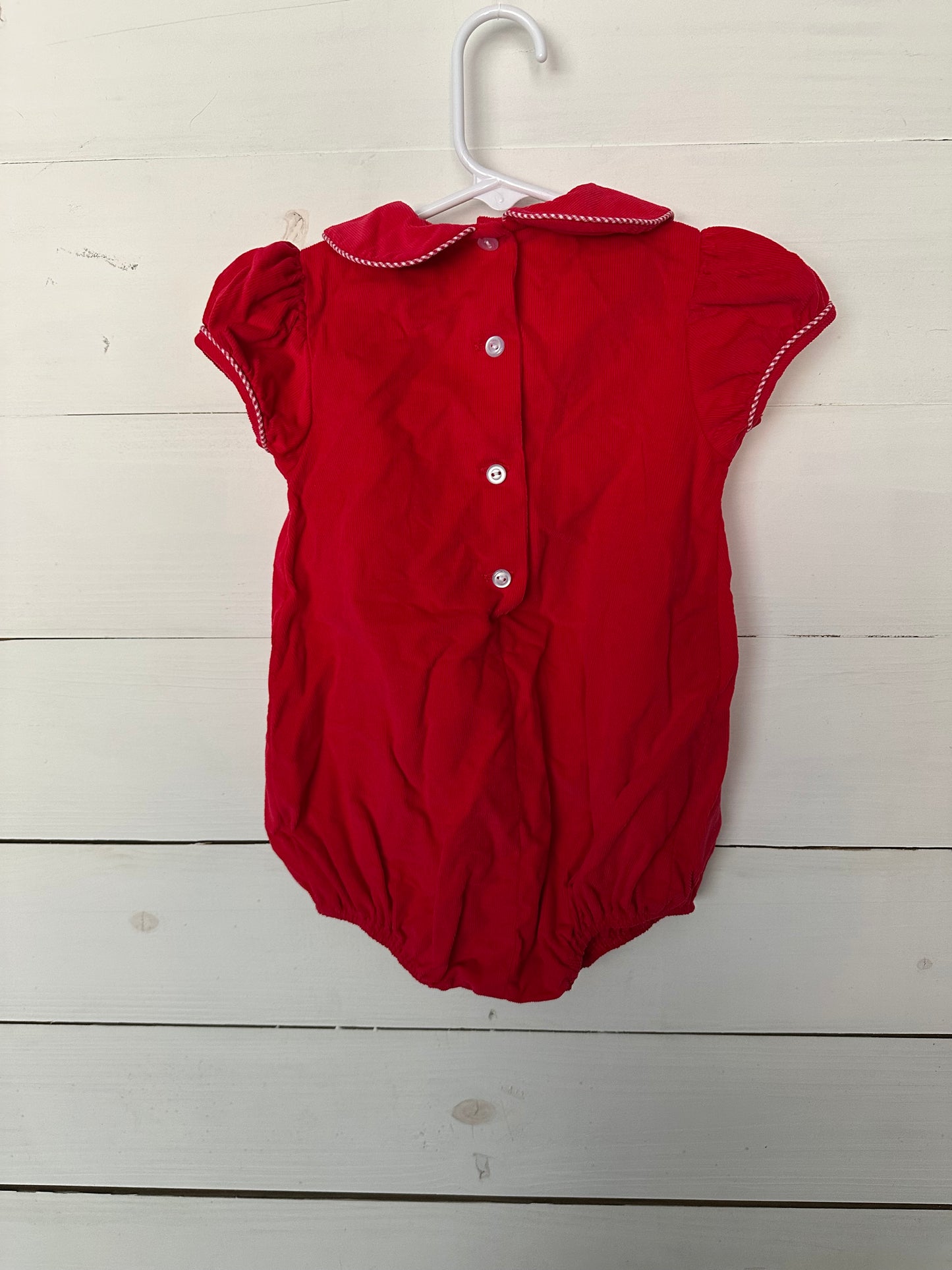 Janie & Jack pink collared onesie with flowers & red leggings with bows at the bottom