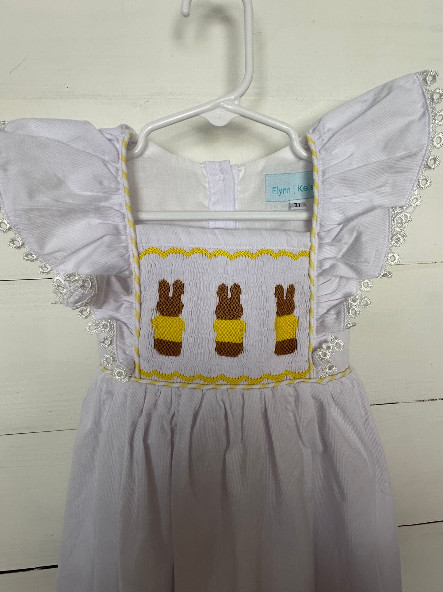Flynn & Kelsey White Dress with Smocked Easter Bunnies & Flutter Sleeves