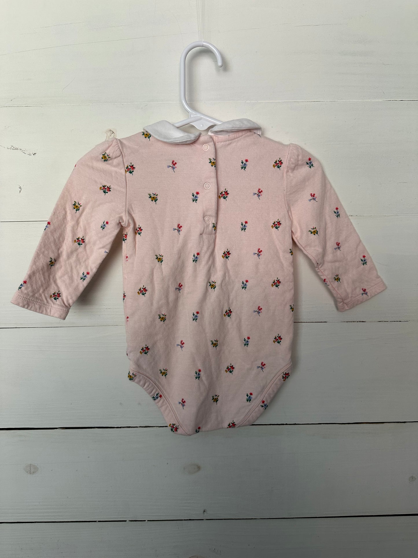 Janie & Jack pink collared onesie with flowers & red leggings with bows at the bottom