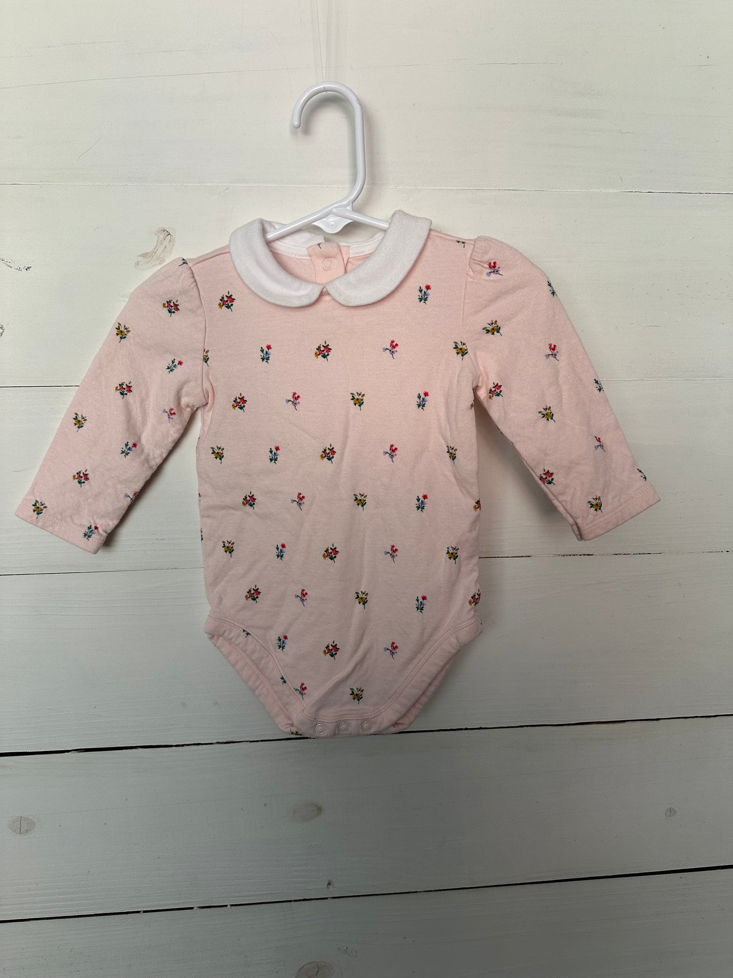 Janie & Jack pink collared onesie with flowers & red leggings with bows at the bottom