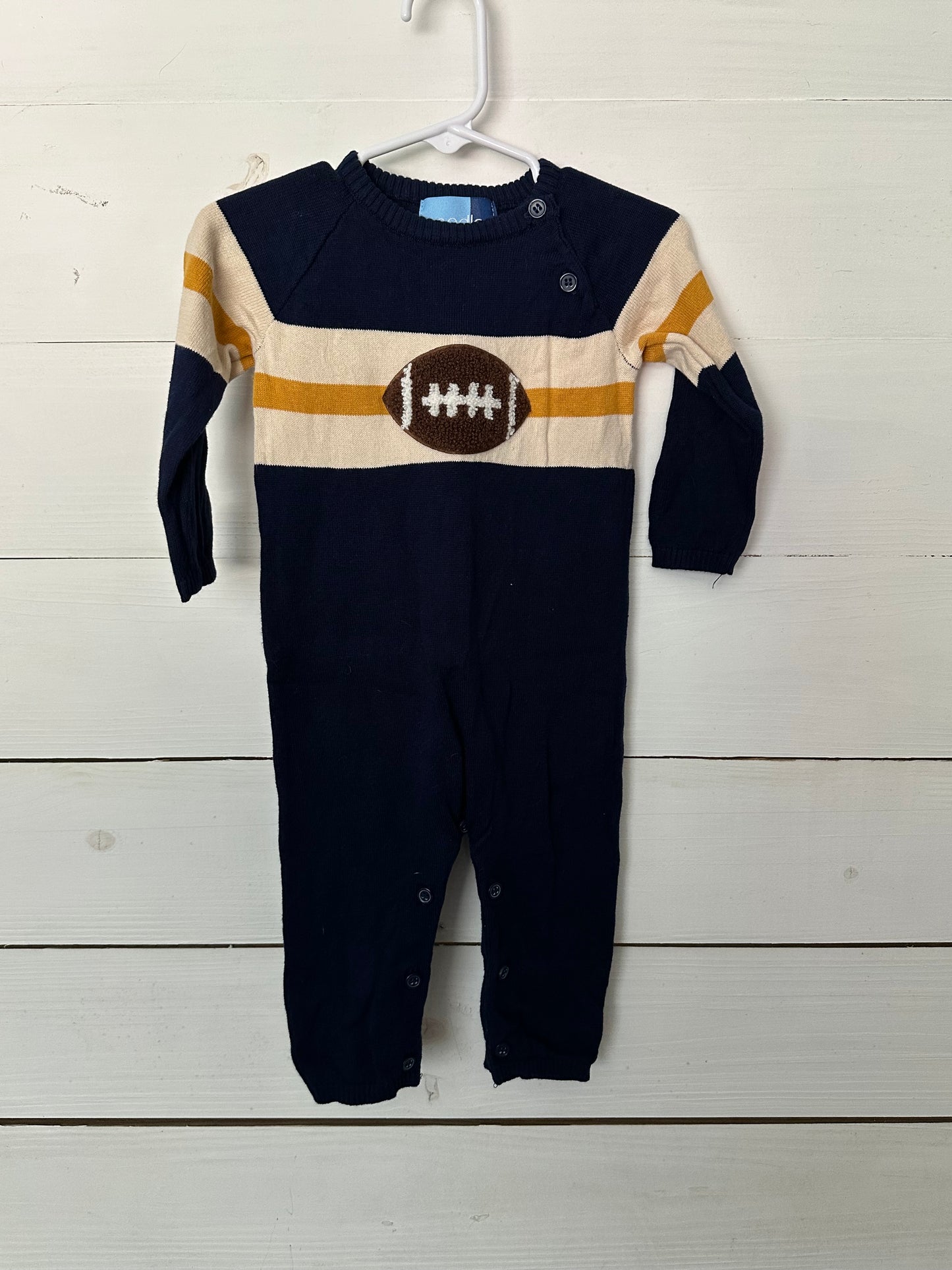 Good Lad knit navy football romper with gold and white accents